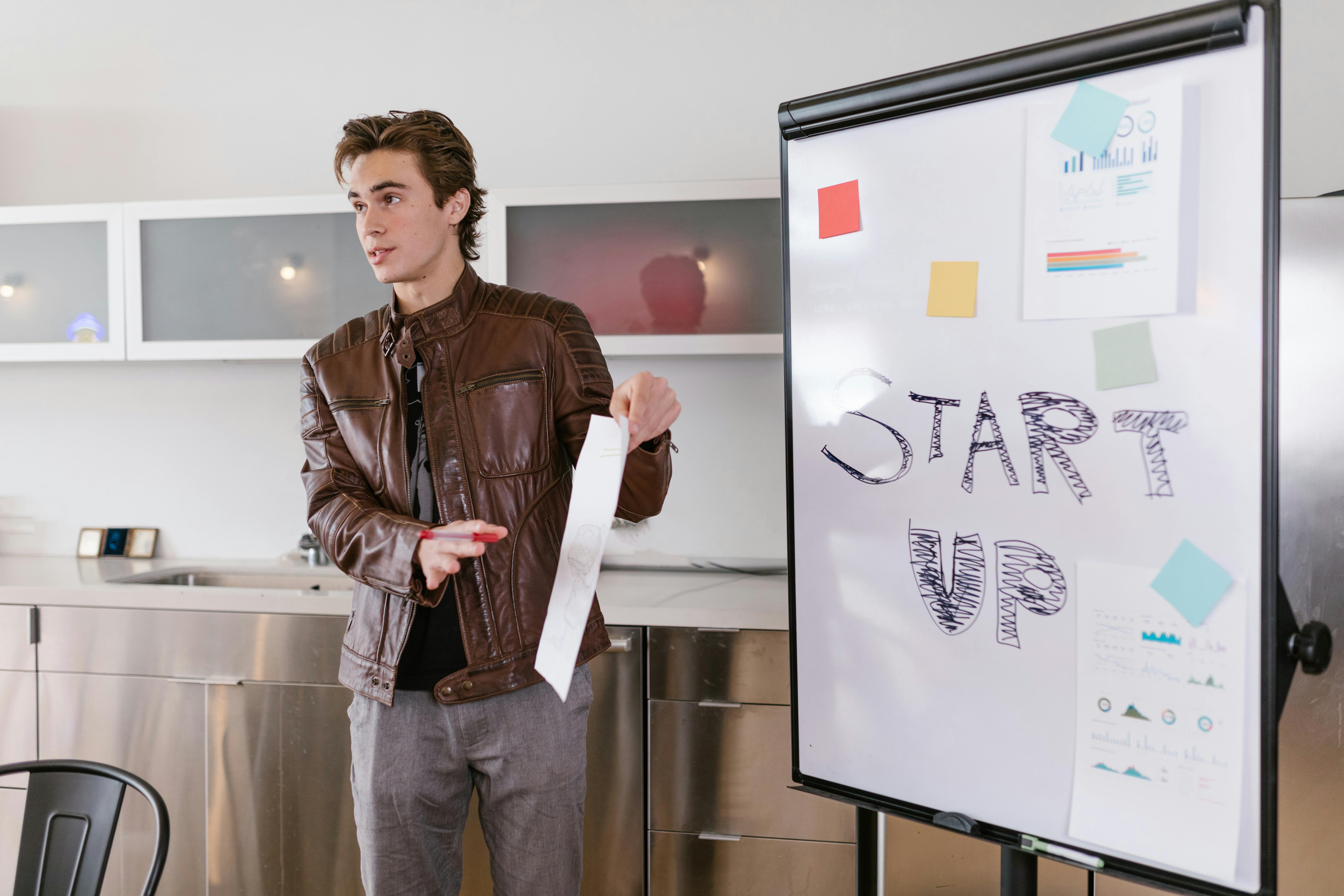 Founder presenting a startup idea on a whiteboard